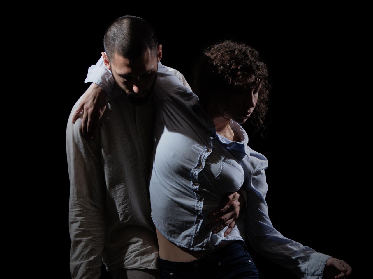 push/FOLD dancer Jessica Evans being lifted by artistic director Samuel Hobbs in deep shadow in 'Early' at Columbia Dance Center in Vancouver, Washington | Photographer: Jingzi Zhao