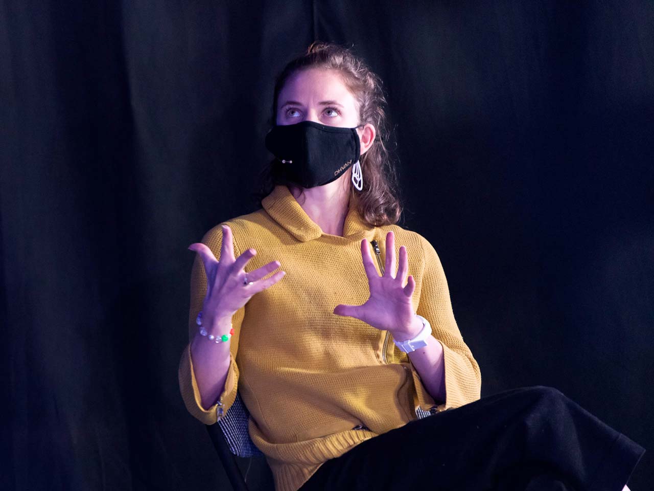 Union PDX - Festival:20 artist Andrea Parson wearing a yellow sweater speaks at the live-streamed artist discussion at Polaris Dance Theatre in Portland, Oregon | Photography: Jingzi Zhao