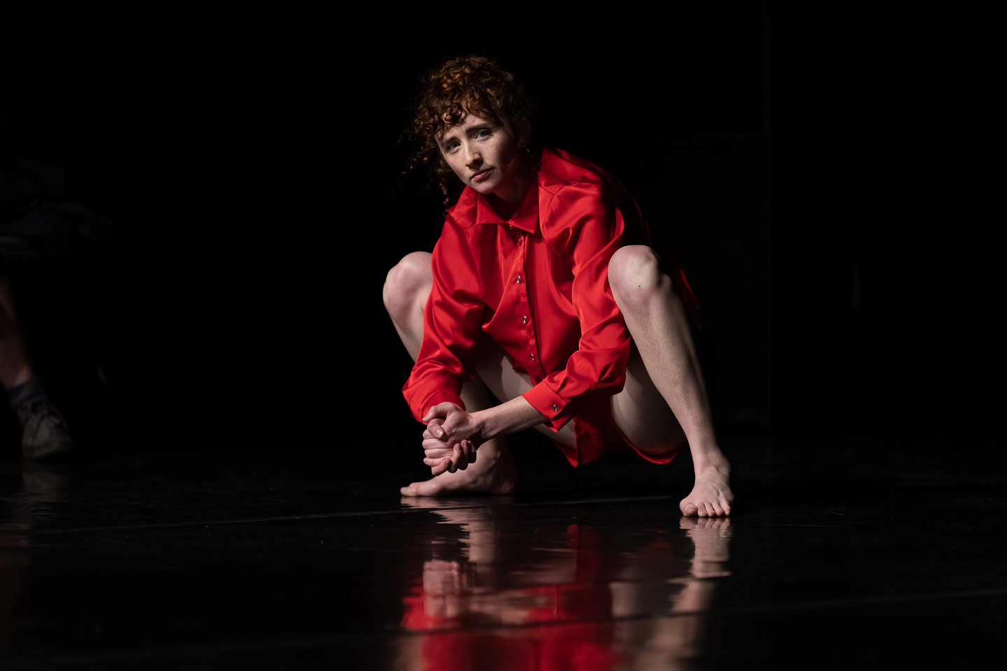 Union PDX - Festival:22 artist Megan Doheny performs her work 'doings'. Photo depicts Megan in a squat position looking at the viewer. | Photography: Jingzi Zhao