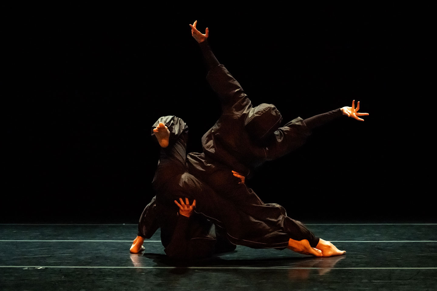 Dancers perform Union PDX - Festival:23 company Compagnia Bellanda's work 'Simposio'. Photo depicts two dancers in breakdance style partnering. | Photography: Jingzi Zhao