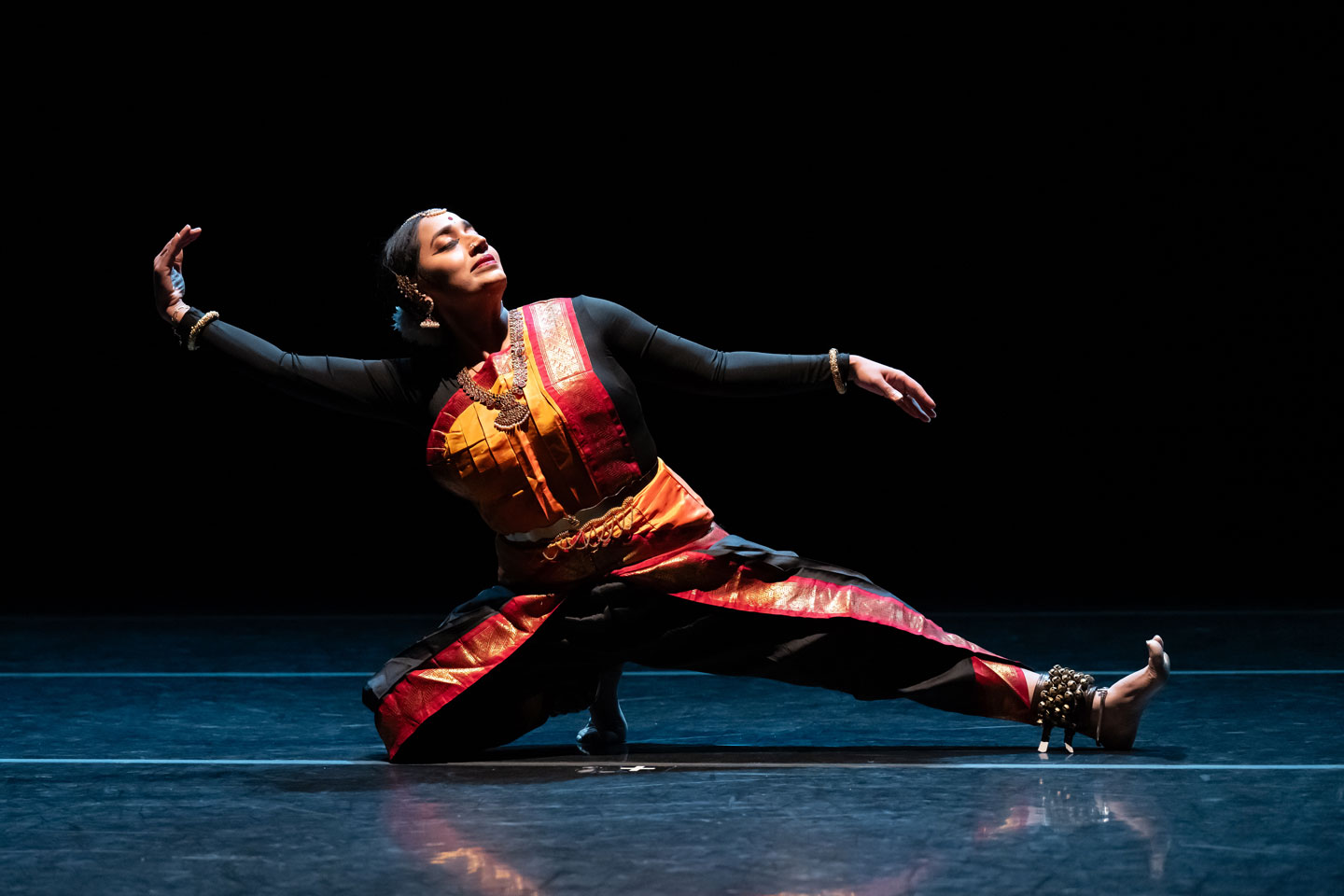 Union PDX - Festival:23 artist Sridharini Sridharan performs her work 'A Clarion Call'. Photo depicts Sridharini posing elegantly with leg outstretched. | Photography: Jingzi Zhao